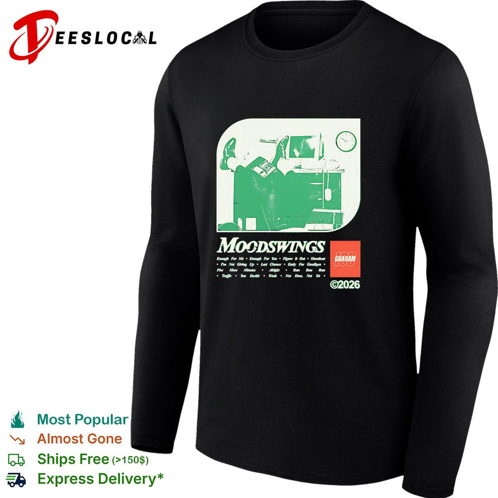 Graham Moodswings man resting legs on desk shirt