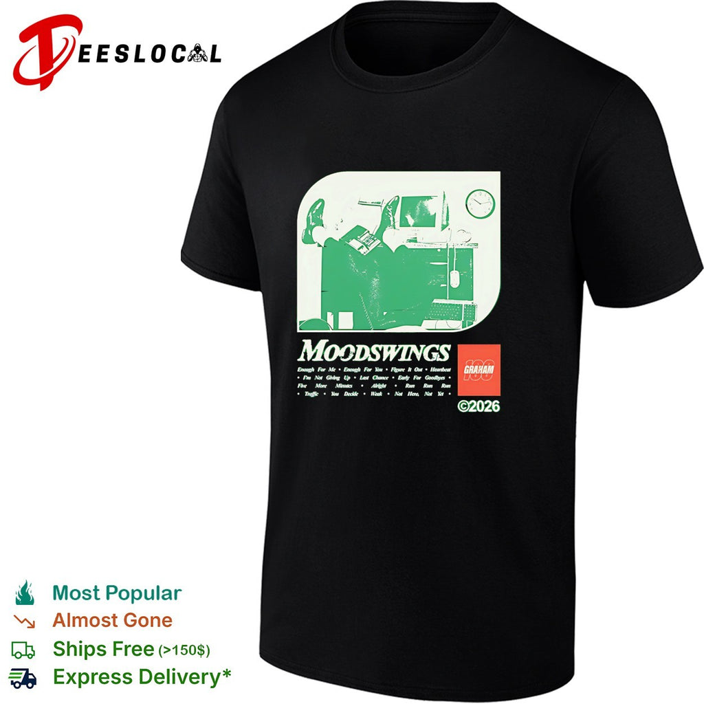Graham Moodswings man resting legs on desk shirt